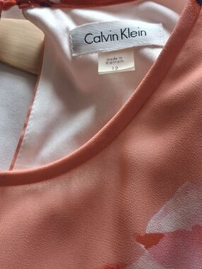 Calvin Klein Coral Sleeveless Dress. Round Neck. Peek A Boo Back Button Hole.